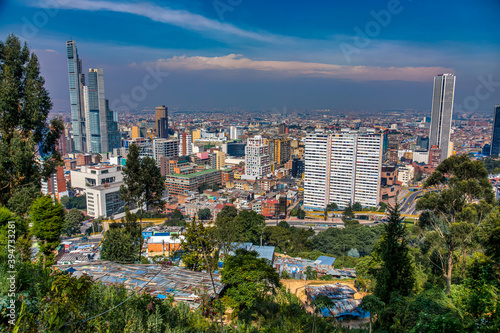 BOGOTA,COLOMBIA/MARCH 15,2018:Panoramic view of the city of Bogota. In the foreground are slum roofs.