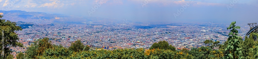 BOGOTA,COLOMBIA/MARCH 15,2018:Panoramic view of the city of Bogota. In the foreground are slum roofs.