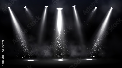 Stage illuminated by spotlights. Empty scene with spot of light on floor. Vector realistic illustration of studio, theater or club interior with beams of lamps, smoke and glowing particles