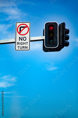 No right turn sign on red traffic signal light