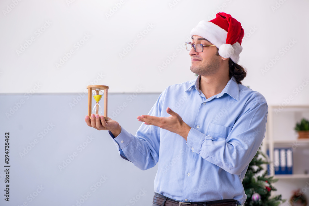 Young male teacher celebrating new year at school Young male teacher celebrating new year at school