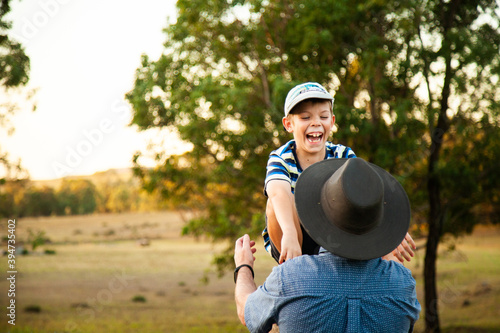 Father ready to catch laughing son photo