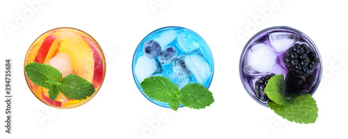 Set of different refreshing drinks made with soda water on white background, top view. Banner design