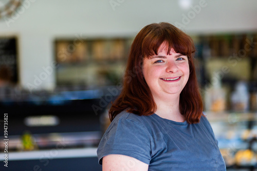Portrait of a happy young woman at a cafe