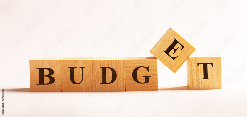 On a light background, wooden cubes with the text BUDGET On a light background, wooden cubes with the text BUDGET