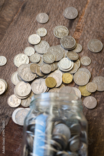 glass jar filled with Australian money