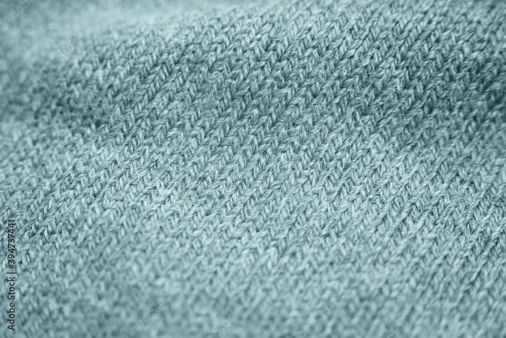 Obraz premium Close up of green knitted textured background.