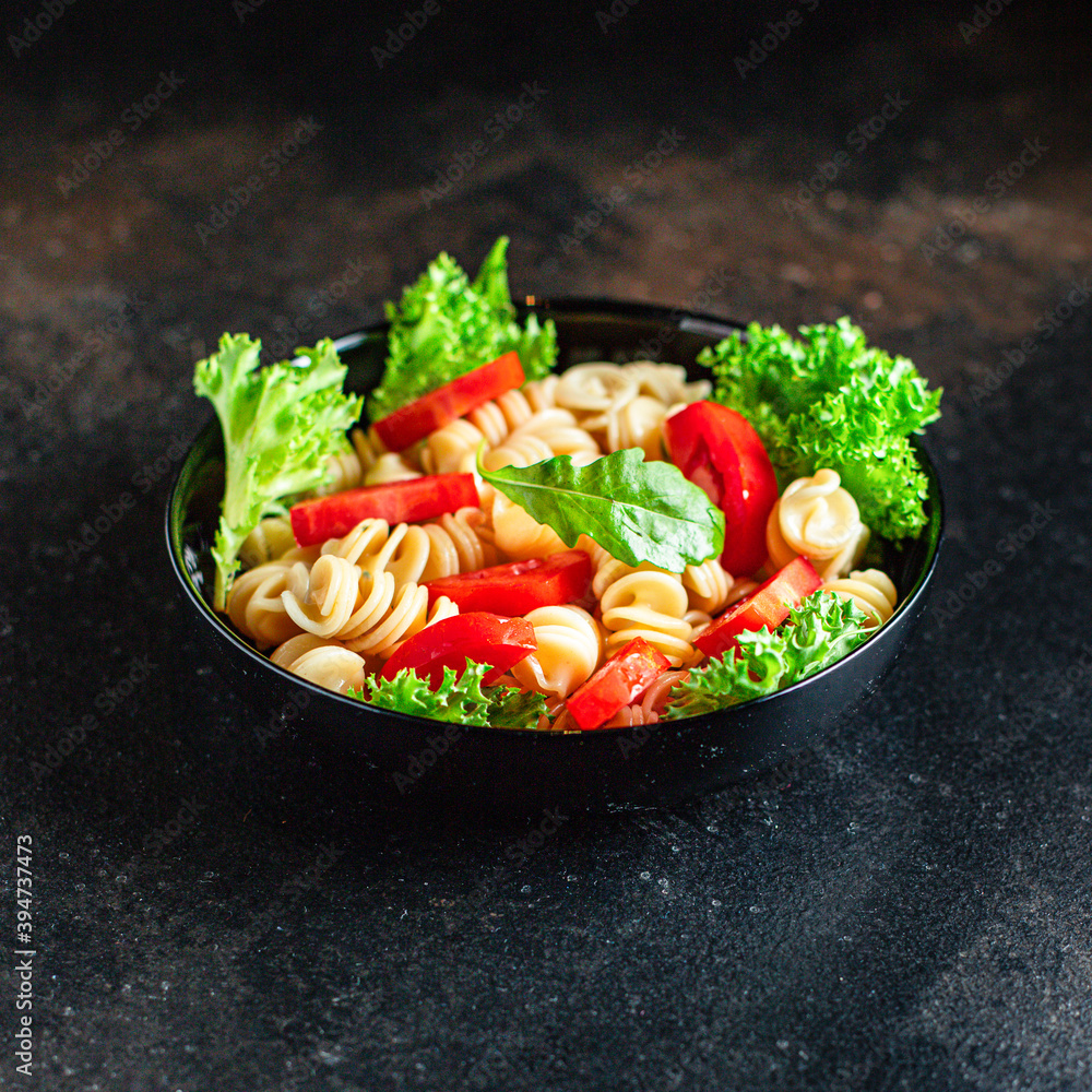 pasta salad fusilli tomato snack vegetable lettuce healthy gluten free ingredient vitamin top view copy space for text food background pasta salad fusilli tomato snack vegetable lettuce healthy gluten free ingredient vitamin top view copy space for text food background