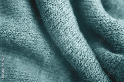 Close up of green knitted textured background.