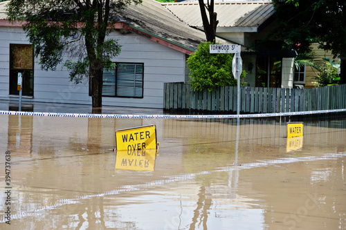 Submerged flood sign reading 