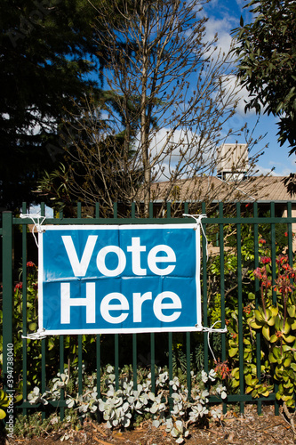 Vote here sign photo