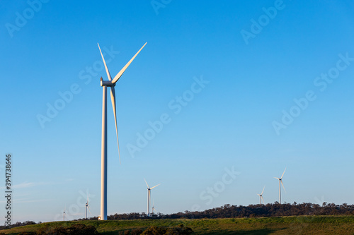 Wind turbines on scrubby hill tops