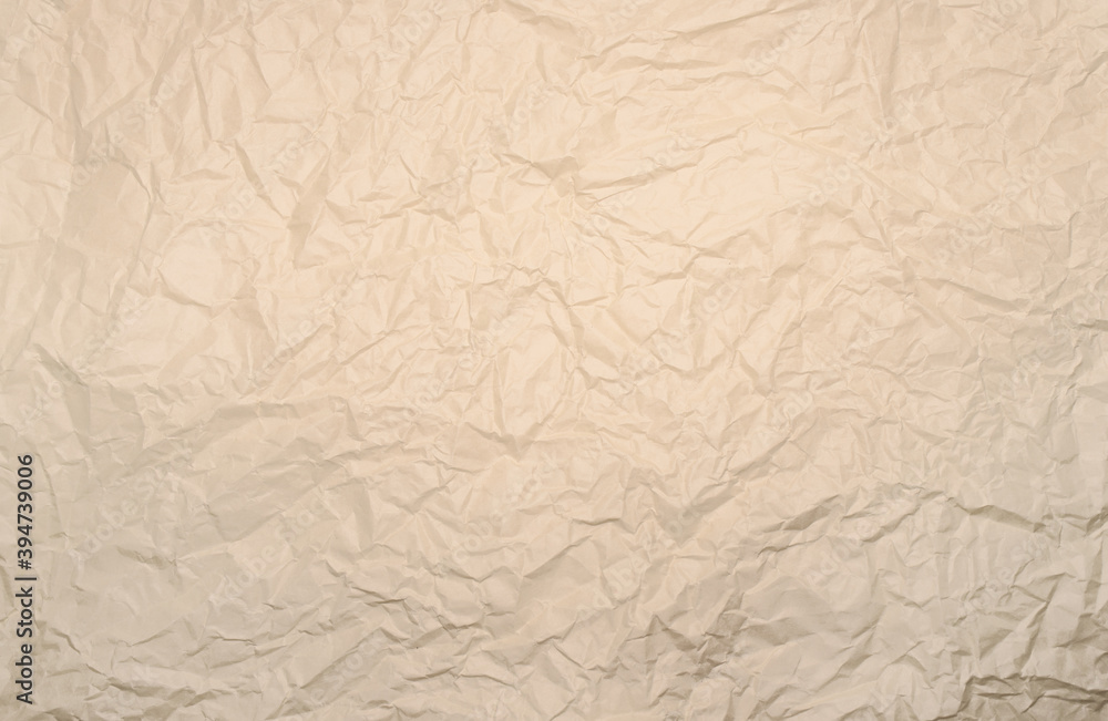Crumpled, creased white or beige paper texture