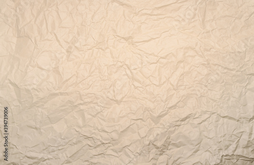 Crumpled, creased white or beige paper texture