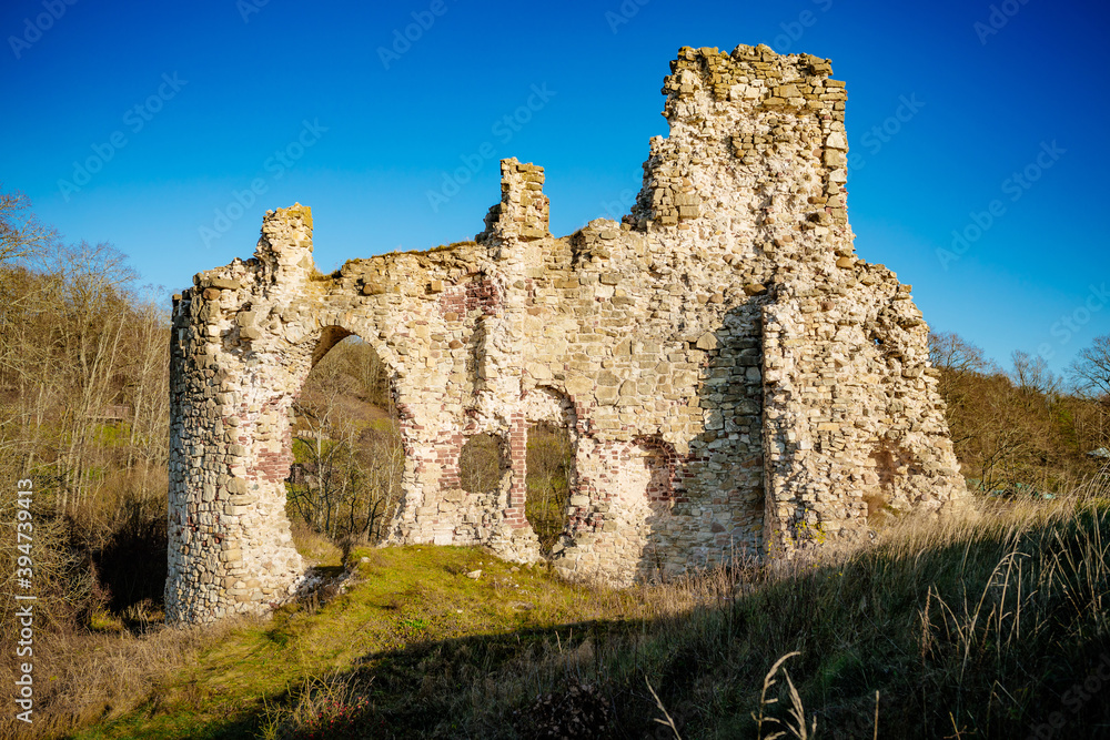 Ruined medieval castle in Aizkraukle, Latvia in sunny day.