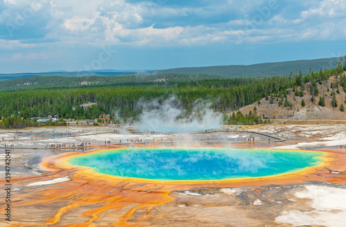 Aerial landscape of the Grand Prismatic Spring with elevated walkway and people walking, Yellowstone national park, Wyoming, USA.