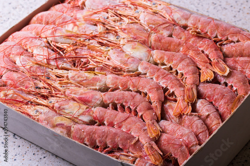 Argentine langoustines frozen in a box as a background