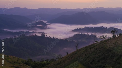 4K time lapse of beautiful mountain range misty morning in Mon mok ta wan viewpoint in Phop phra located in Tak province, Thailand photo