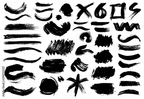 Creative isolated paint brush strokes or spots. Ink smudge abstract shape stains and smear set with texture. Grunge design elements. Collection of different brushes and drops