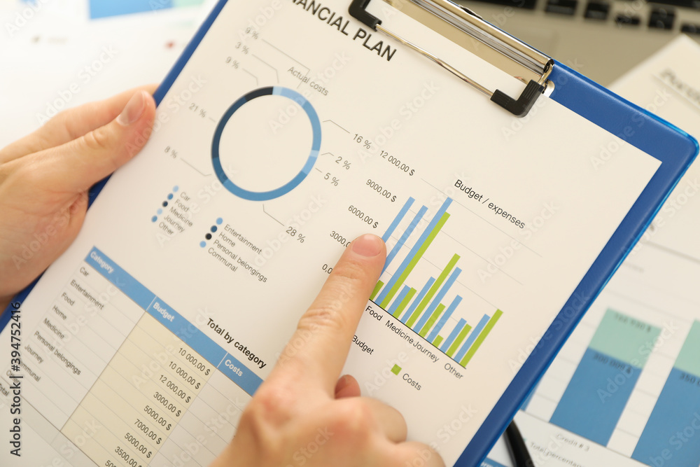 Concept of finance with man doing a financial planning Concept of finance with man doing a financial planning