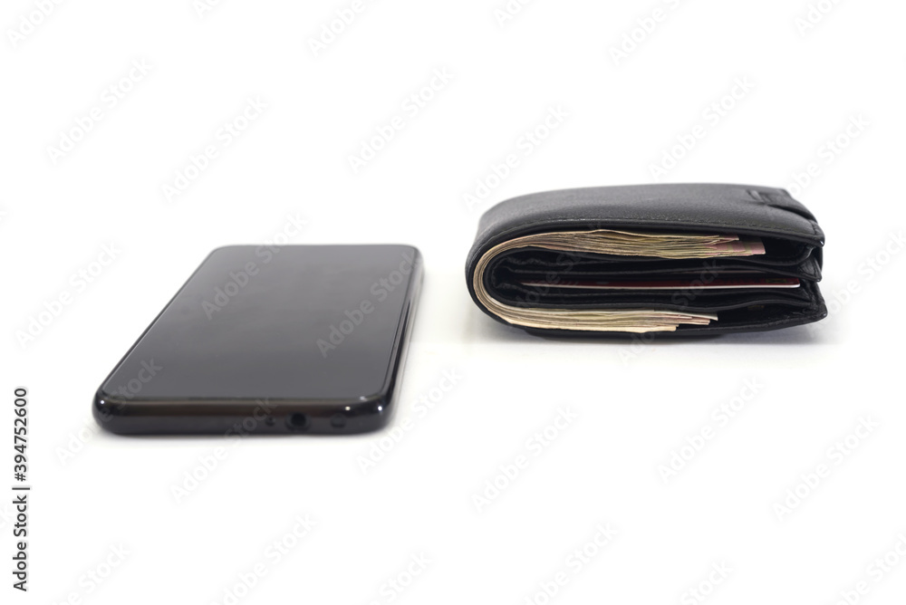 black smartphone and black men's wallet on a white black smartphone and black men's wallet on a white