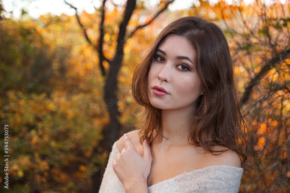 Beautiful young woman walking in the autumn forest Beautiful young woman walking in the autumn forest