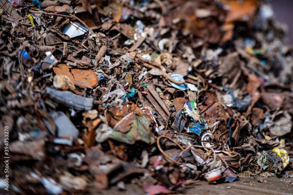 Close-up of scrap metal. Dump of rusty iron debris. Metal garbage.