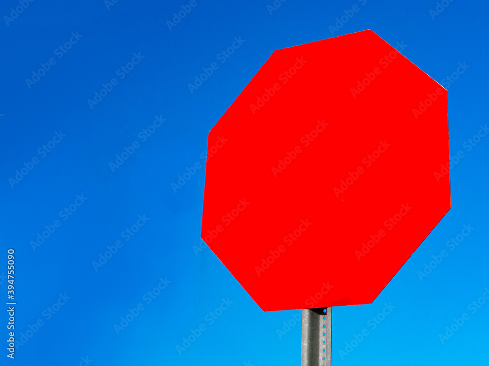 empty red stop sign with clear blue sky Stock Photo | Adobe Stock