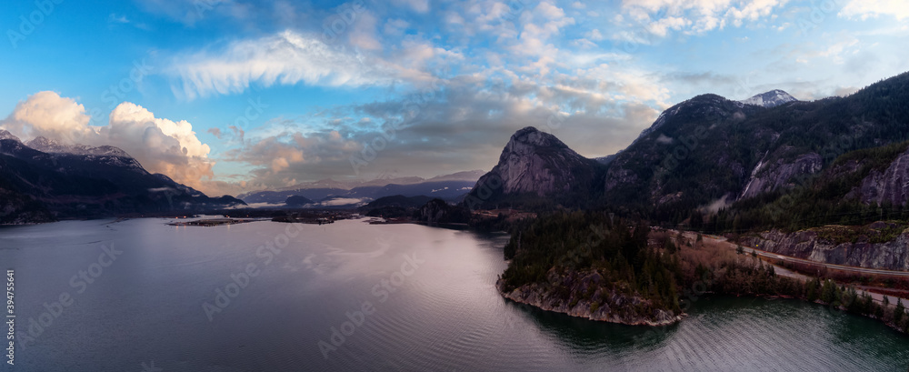 Aerial Panoramic view of Sea to Sky Highway with Chief Mountain in the background. Colorful Twilight Sky Art Render. Taken near Squamish, North of Vancouver, British Columbia, Canada.