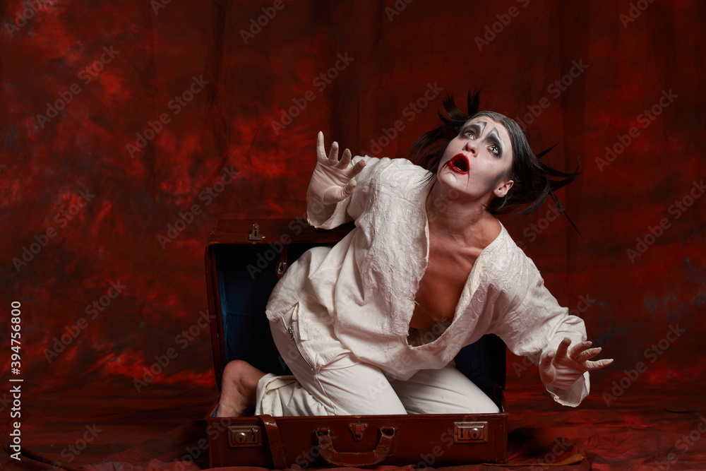 The art of depression. Studio portrait of young female model performing as an old clown suffering from pandemic lockdown and isolation. Pandemic stress conception The art of depression. Studio portrait of young female model performing as an old clown suffering from pandemic lockdown and isolation. Pandemic stress conception