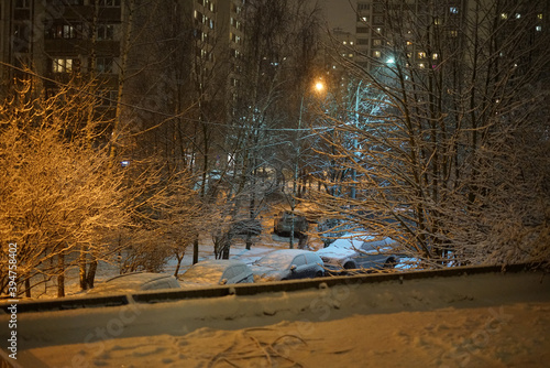 The first snow and snowdrifts. Night. December. Urban landscape.