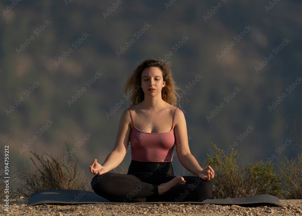 woman doing yoga exercise outdoors