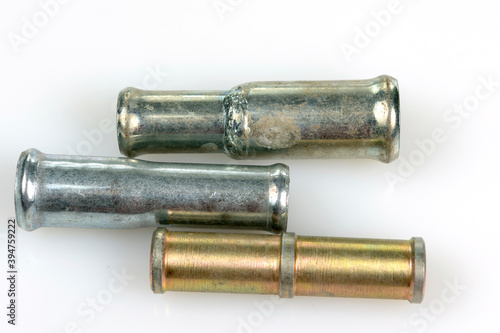 short size metal tubes on white background