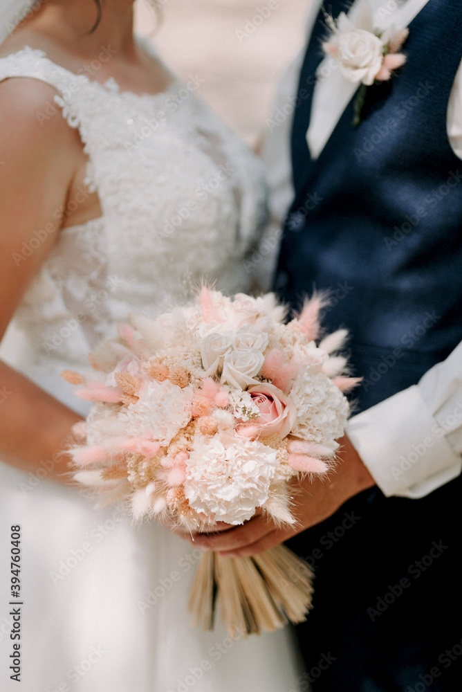 elegant wedding bouquet of fresh natural flowers and greenery