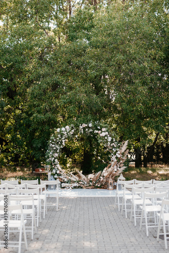 wedding ceremony area  arch chairs decor