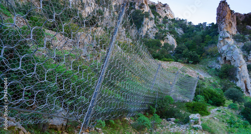 фотографія robust rockfall barrier along the panoramic road of buggerru, south sardinia