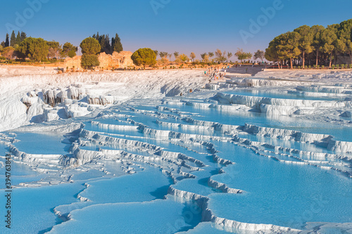 One of the main tourist attractions in Turkey is the travertines and Pamukkale hot springs. Scenic panoramic view on turkish resort photo