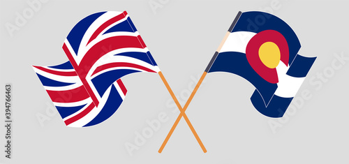 Crossed and waving flags of The UK and The State of Colorado