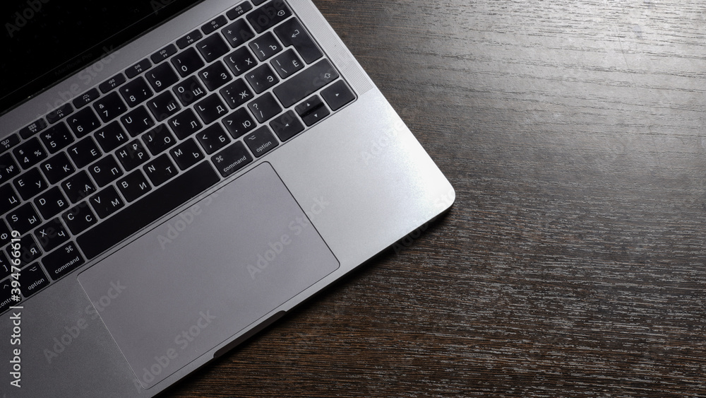 Laptop on a brown table Laptop on a brown table