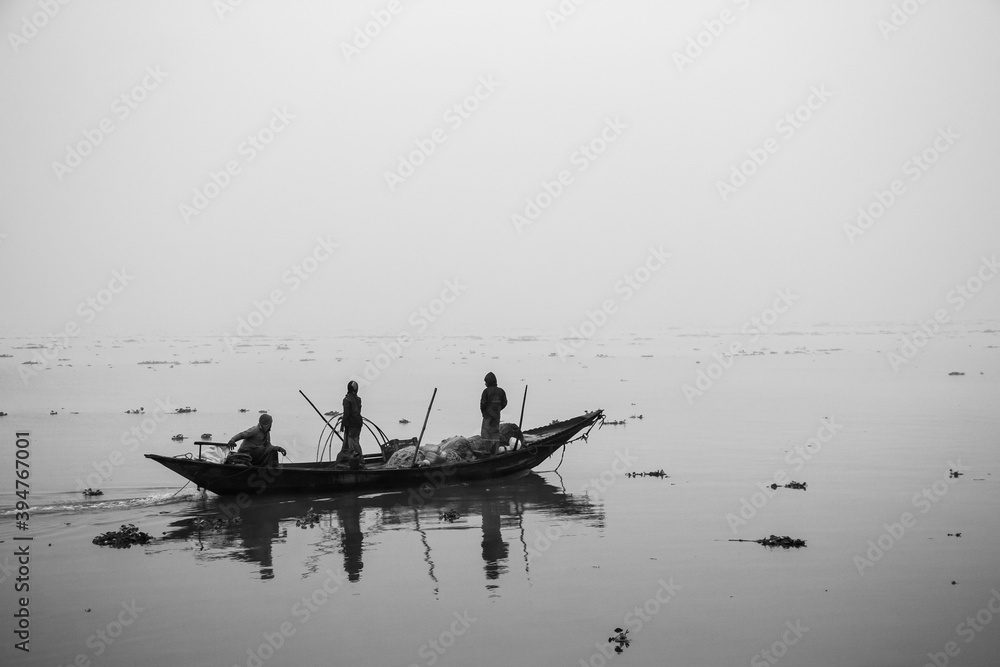Fisherman fishing in the winter morning,