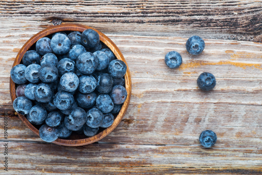 blueberries in a wooden plate blueberries in a wooden plate