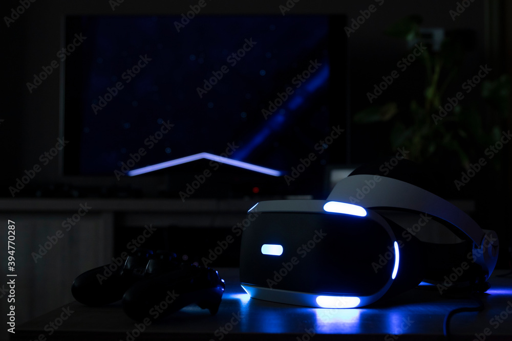 Brecht, Belgium - June 12 2019: A playstation VR headset in a dark room  showing its iconic