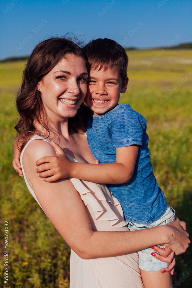 Mom holds her son's family love summer Mom holds her son's family love summer