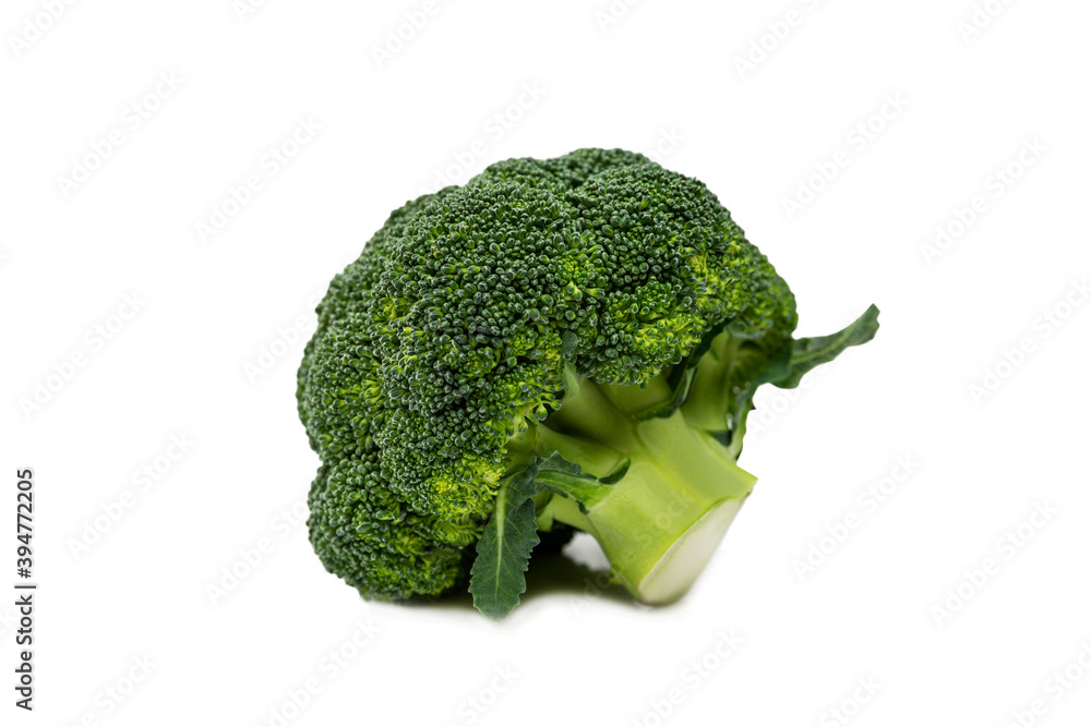 Head of broccoli on an isolated white background. Healthy food and vitamins. Close-up. Head of broccoli on an isolated white background. Healthy food and vitamins. Close-up.
