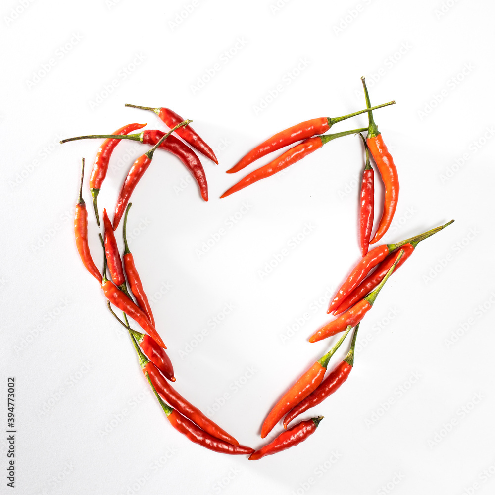 Fototapeta premium A lot of red hot miniature pepper in the circle isolated on white.