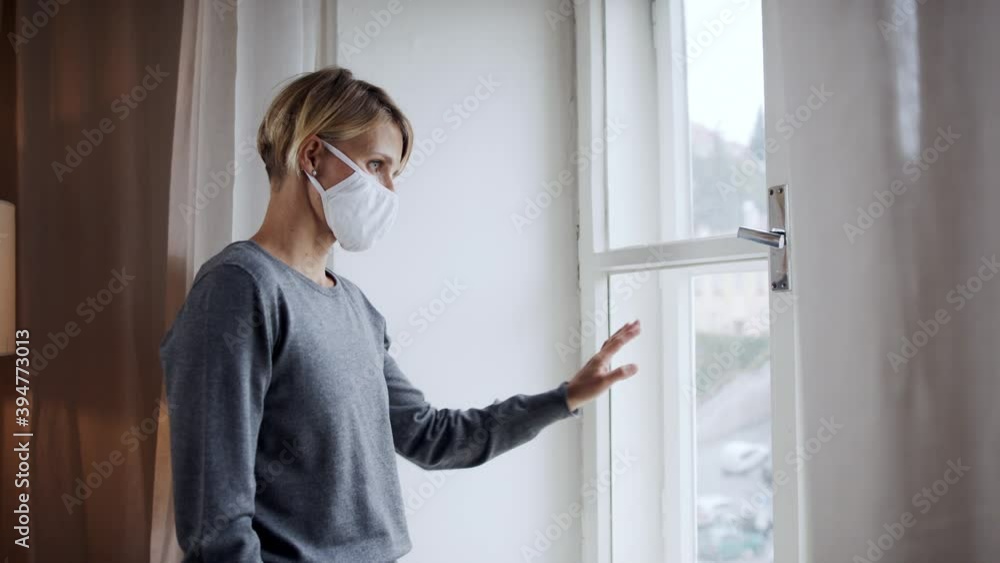 Woman indoors at home feeling stressed, mental health and coronavirus concept. Woman indoors at home feeling stressed, mental health and coronavirus concept.