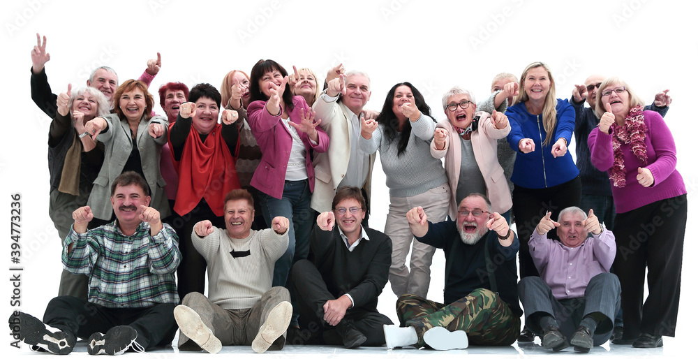 group of happy mature people pointing at you