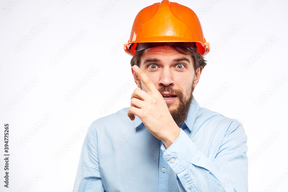 Man in orange helmet shirt construction engineer industry work Man in orange helmet shirt construction engineer industry work