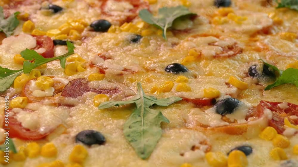 Pizza close-up. Delivery of products. Pizza with cheese, tomatoes and olives Pizza close-up. Delivery of products. Pizza with cheese, tomatoes and olives