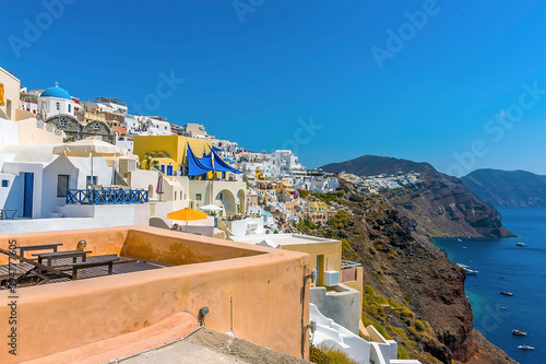 The caldera with the white-capped village of Oia, Santorini in summertime